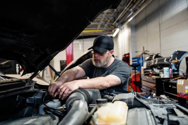 Technician working on vehicle