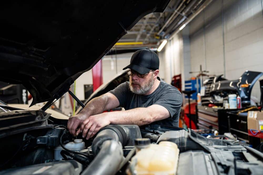 Technician working on vehicle