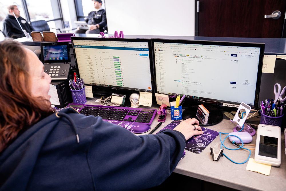 Service writer looking at screen
